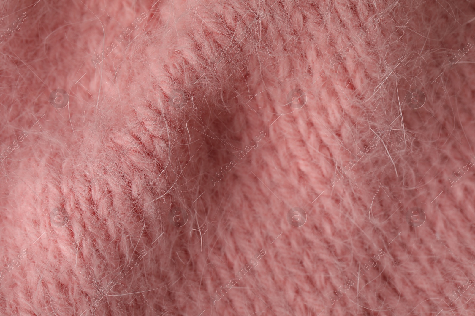 Texture of pink wool fabric as background, top view Photo of Texture of pink wool fabric as background, top view