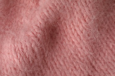 Photo of Texture of pink wool fabric as background, top view