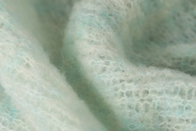 Photo of Texture of turquoise wool fabric as background, closeup