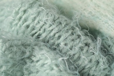 Photo of Texture of turquoise wool fabric as background, closeup