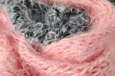 Photo of Texture of pink and grey knitted fabrics as background, closeup