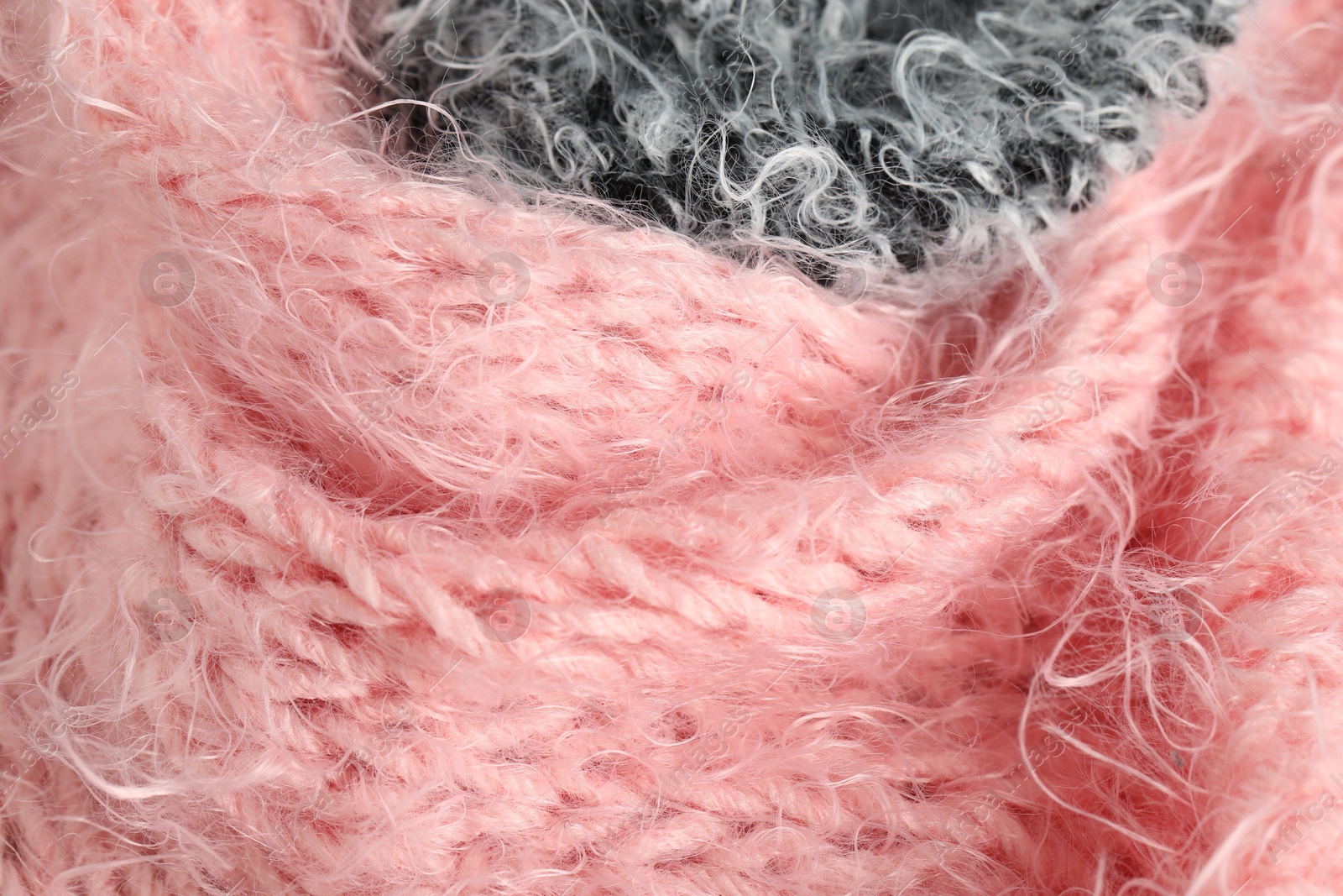 Texture of pink and grey knitted fabrics as background, closeup Photo of Texture of pink and grey knitted fabrics as background, closeup