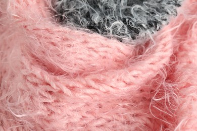 Photo of Texture of pink and grey knitted fabrics as background, closeup