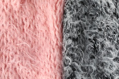 Photo of Texture of pink and grey knitted fabrics as background, top view