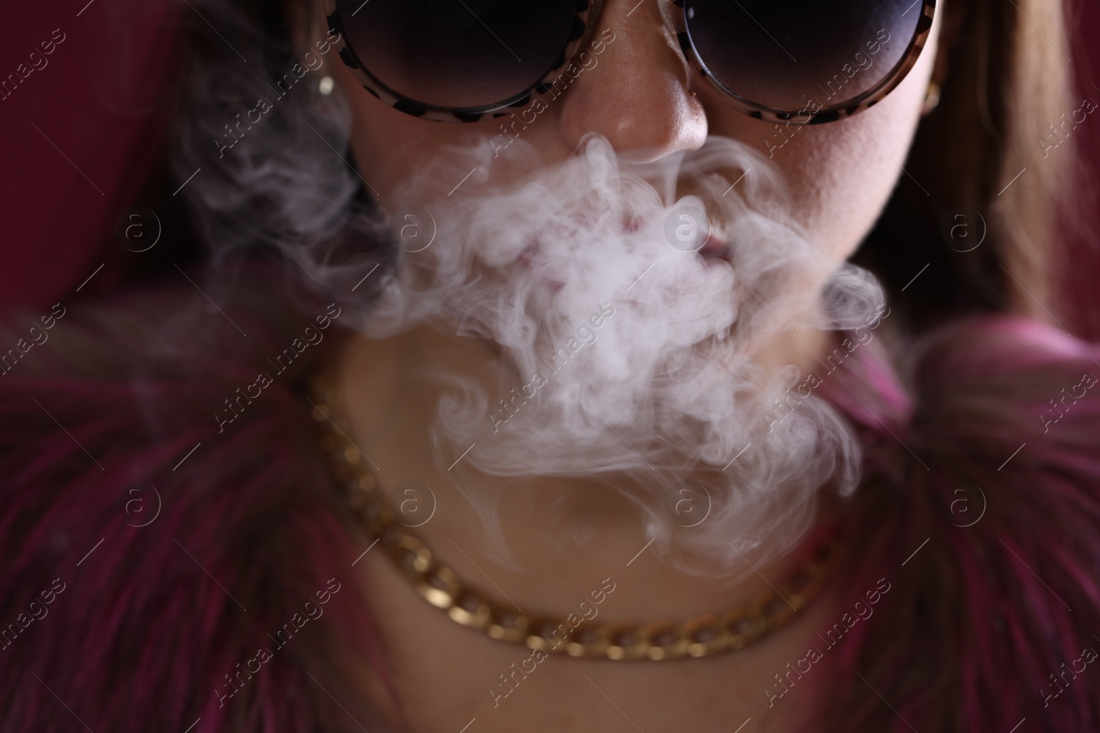 Woman in sunglasses smoking cigarette, closeup. Bad habit Photo of Woman in sunglasses smoking cigarette, closeup. Bad habit