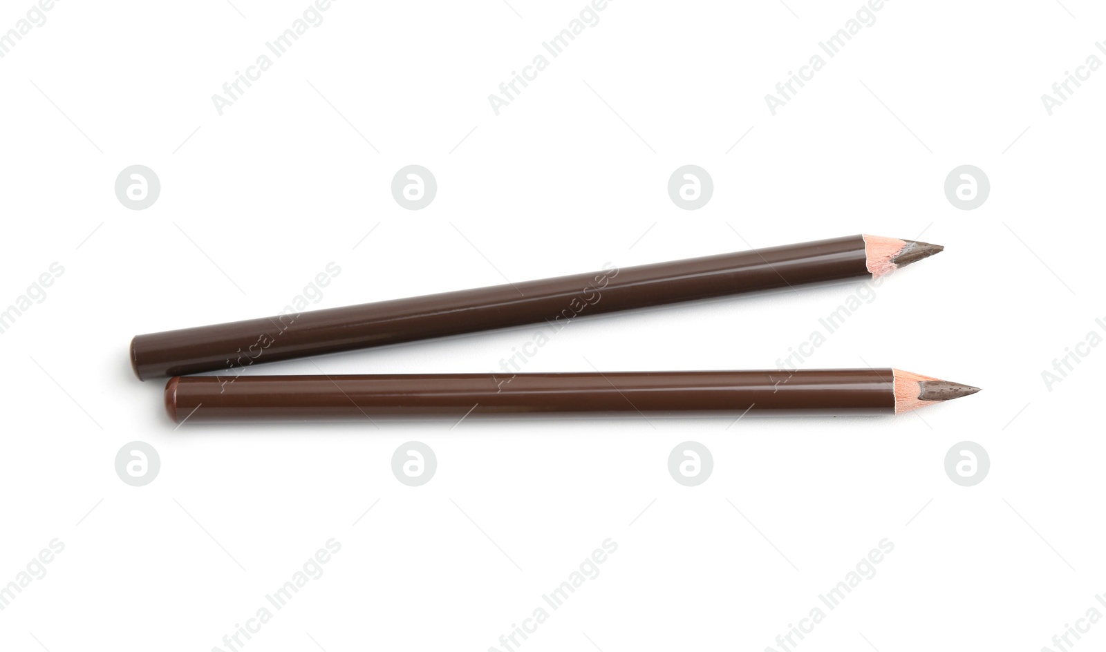 Different eyebrow pencils isolated on white, top view Photo of Different eyebrow pencils isolated on white, top view