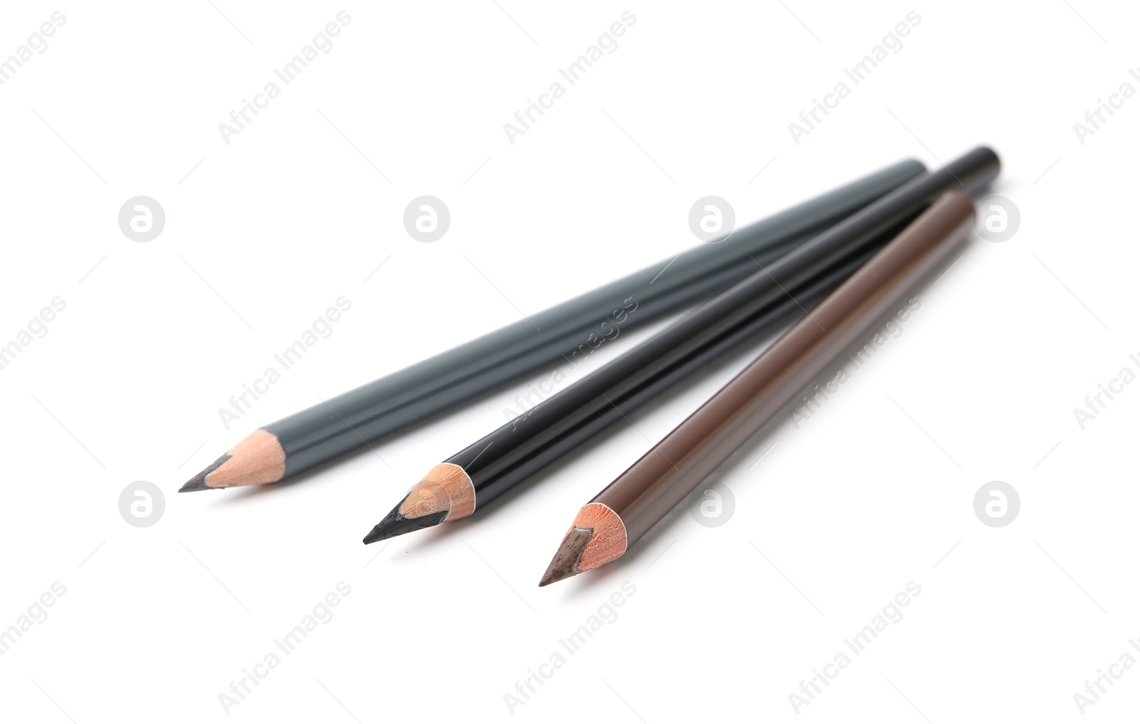 Three different eyebrow pencils isolated on white Photo of Three different eyebrow pencils isolated on white