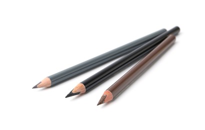 Photo of Three different eyebrow pencils isolated on white