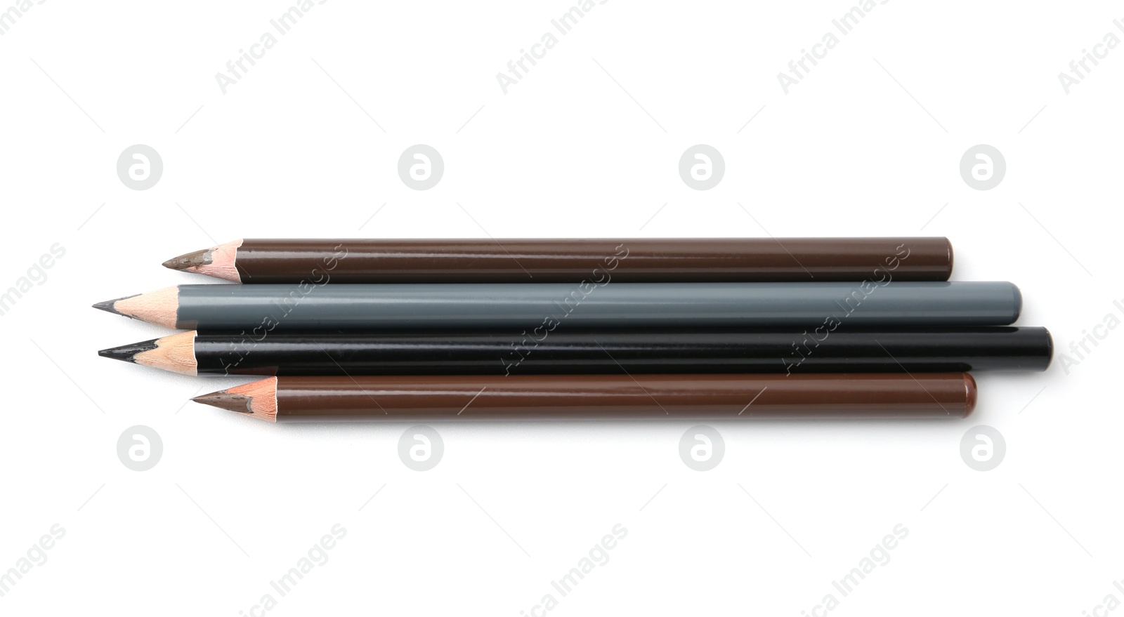 Different eyebrow pencils isolated on white, top view Photo of Different eyebrow pencils isolated on white, top view