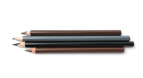 Photo of Different eyebrow pencils isolated on white, top view
