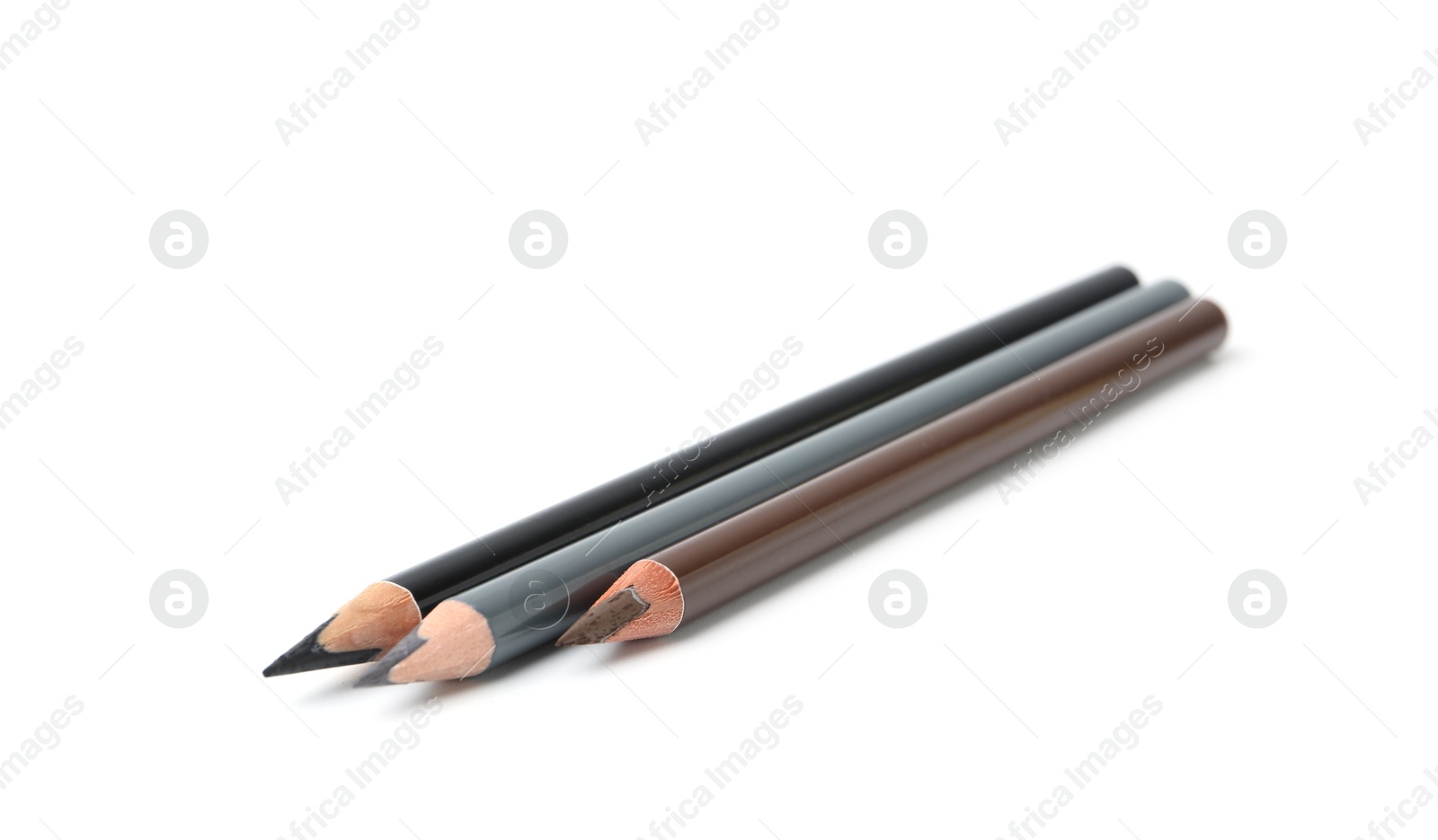 Three different eyebrow pencils isolated on white Photo of Three different eyebrow pencils isolated on white