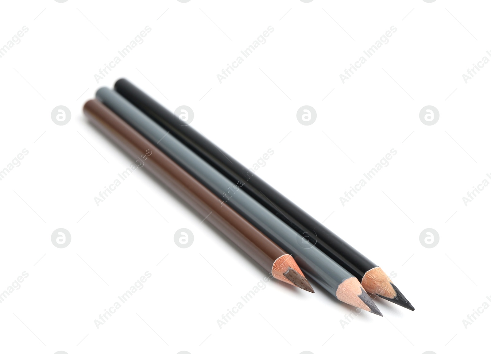 Three different eyebrow pencils isolated on white Photo of Three different eyebrow pencils isolated on white