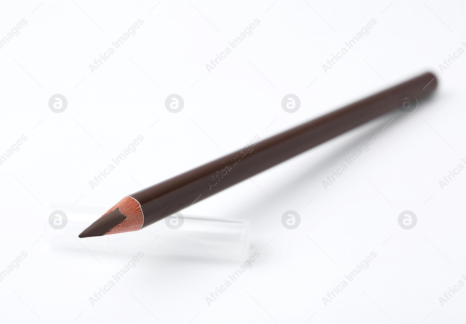 Brown eyebrow pencil on white background, closeup Photo of Brown eyebrow pencil on white background, closeup
