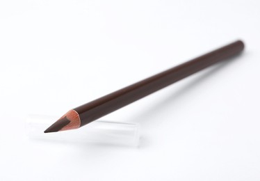 Photo of Brown eyebrow pencil on white background, closeup