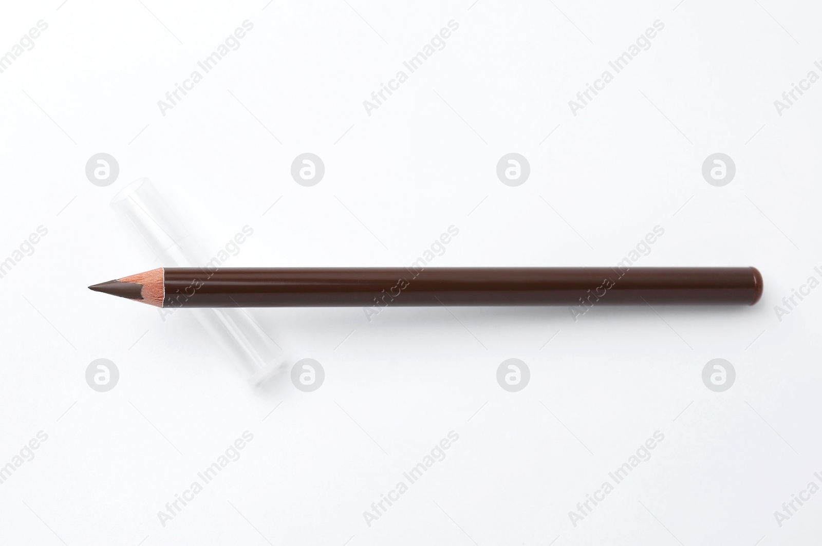 Brown eyebrow pencil on white background, top view Photo of Brown eyebrow pencil on white background, top view