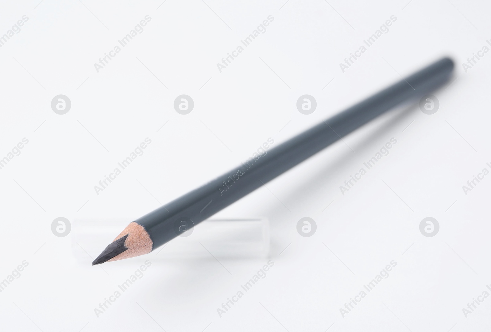 Grey eyebrow pencil on white background, closeup Photo of Grey eyebrow pencil on white background, closeup