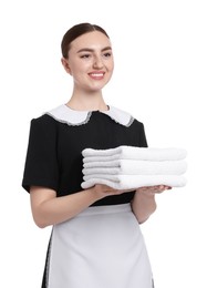 Photo of Chambermaid with stack of clean towels on white background