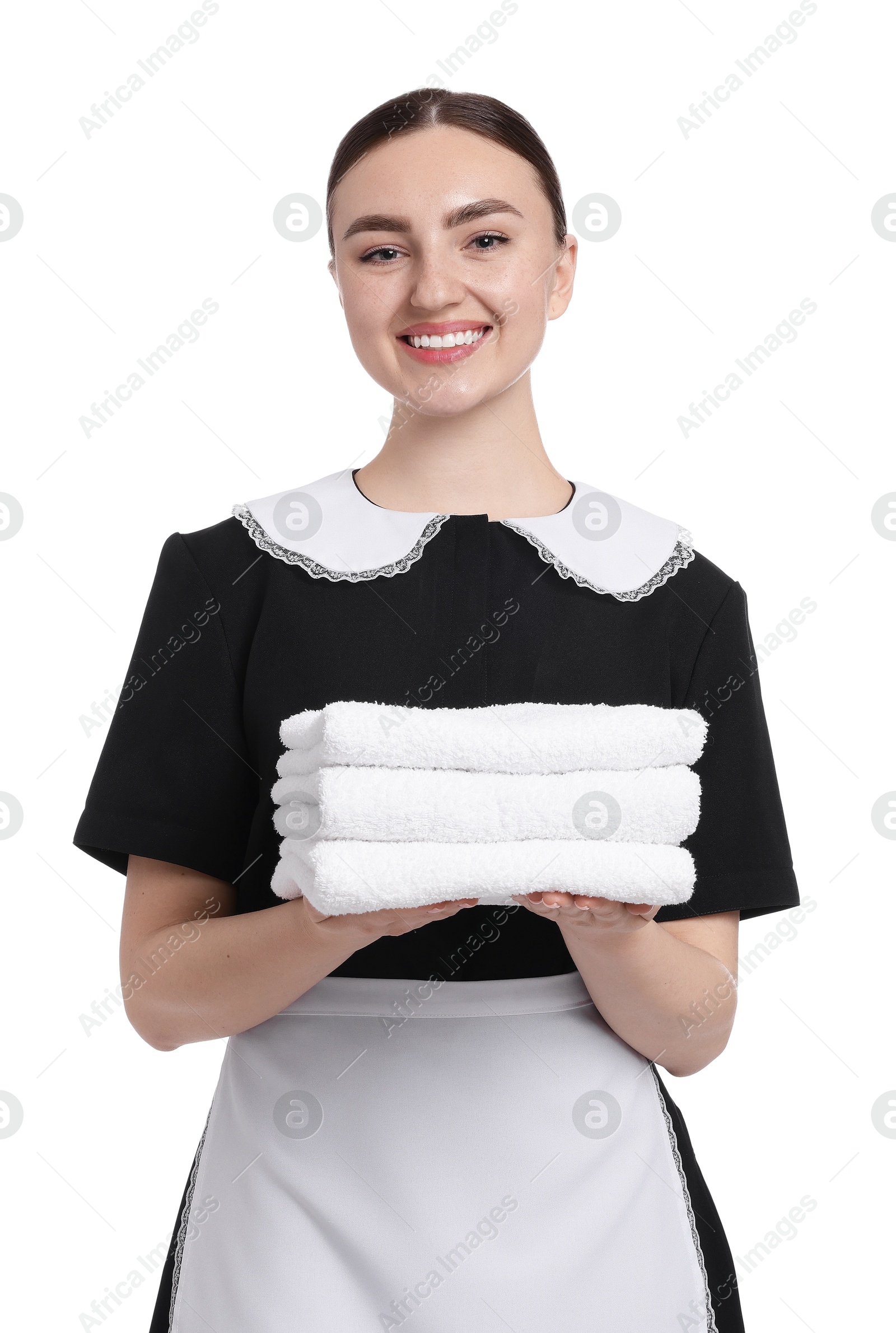 Chambermaid with stack of clean towels on white background Photo of Chambermaid with stack of clean towels on white background