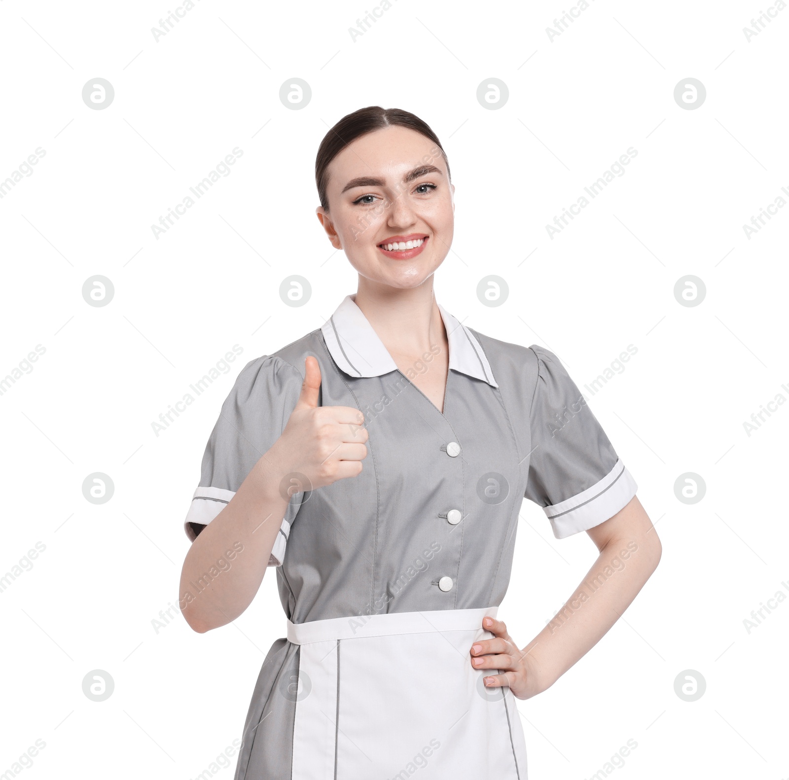 Happy chambermaid showing thumbs up on white background Photo of Happy chambermaid showing thumbs up on white background