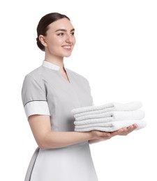 Photo of Chambermaid with stack of clean towels on white background