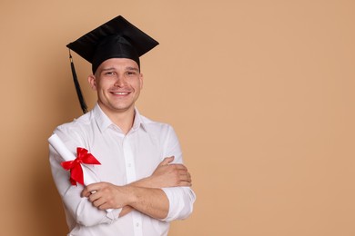 Photo of Happy student with diploma after graduation on beige background. Space for text