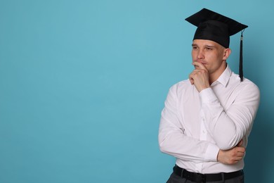 Photo of Thoughtful student after graduation on light blue background. Space for text
