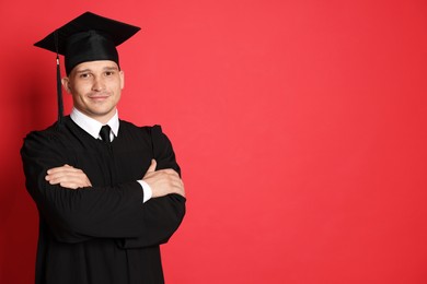 Photo of Student after graduation on red background. Space for text