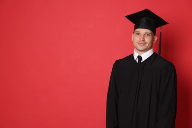 Photo of Student after graduation on red background. Space for text