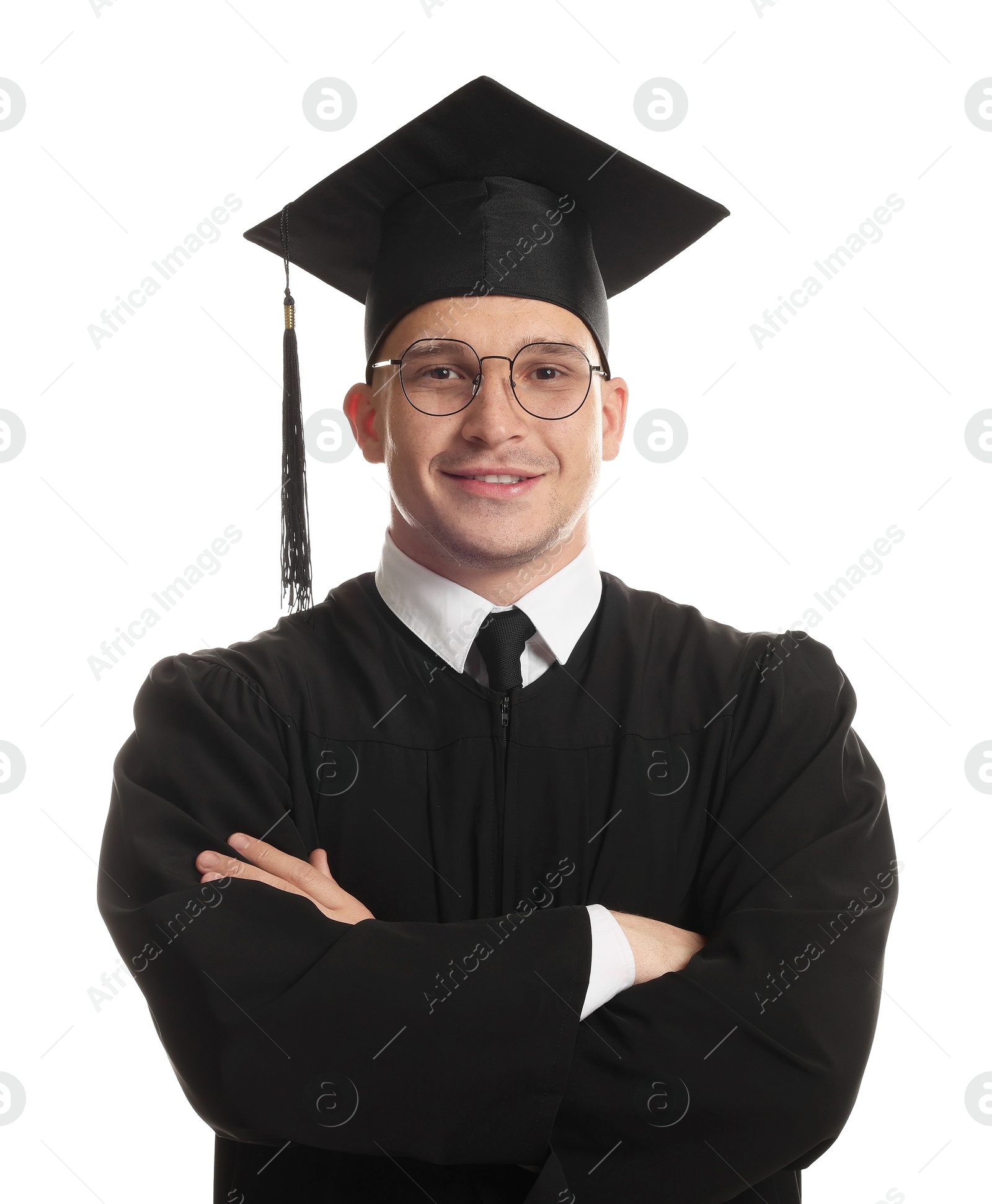 Happy student with crossed arms after graduation on white background Photo of Happy student with crossed arms after graduation on white background