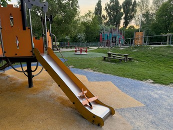 Photo of Empty slide on children's playground in park