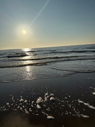 Photo of Wavy sea and beautiful sky at sunset