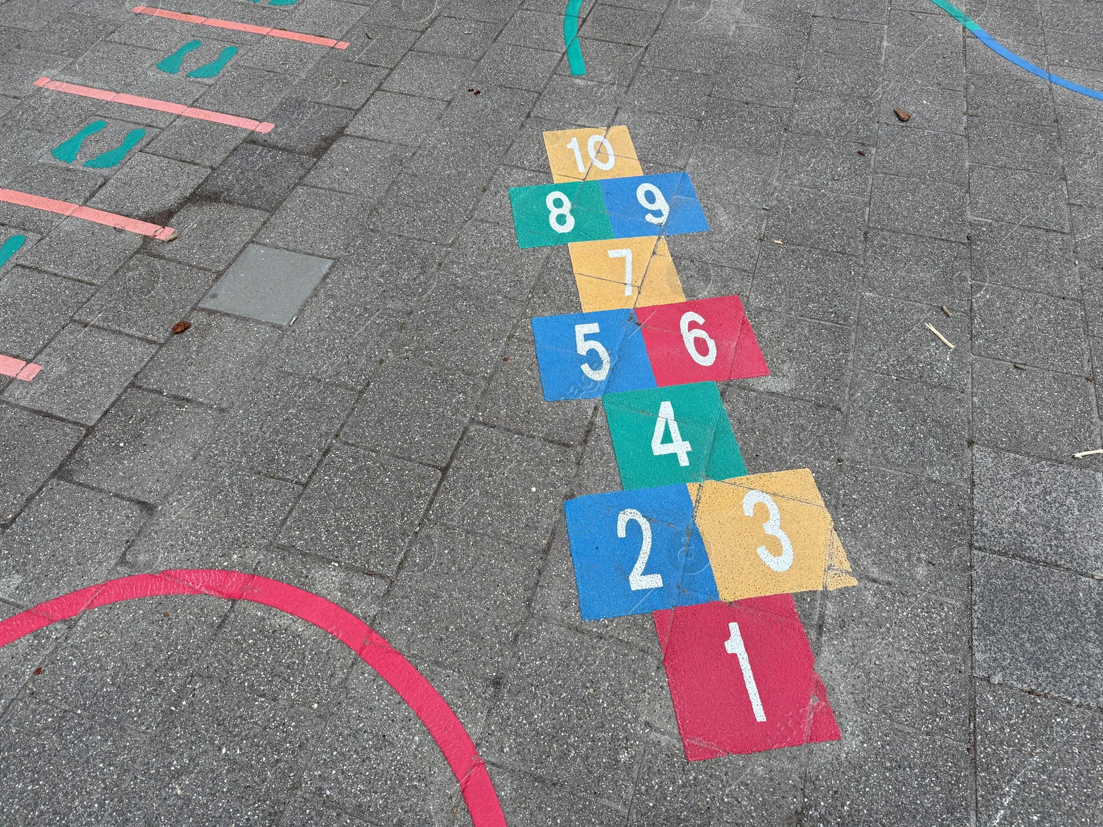 Hopscotch game drawn on asphalt outdoors, above view Photo of Hopscotch game drawn on asphalt outdoors, above view