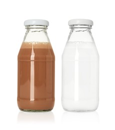 Image of Chocolate drink and milk in glass bottles isolated on white