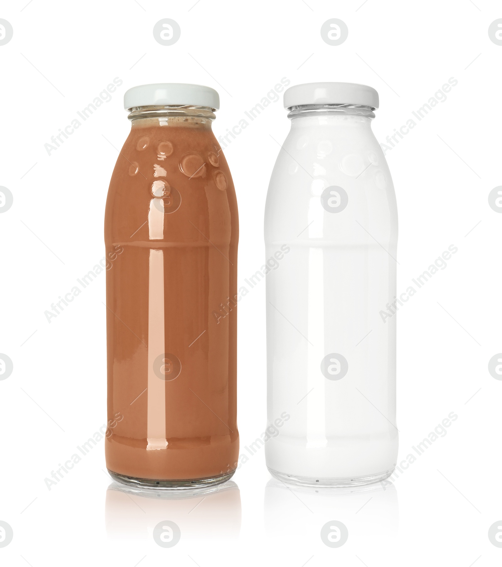 Chocolate drink and milk in glass bottles isolated on white Image of Chocolate drink and milk in glass bottles isolated on white