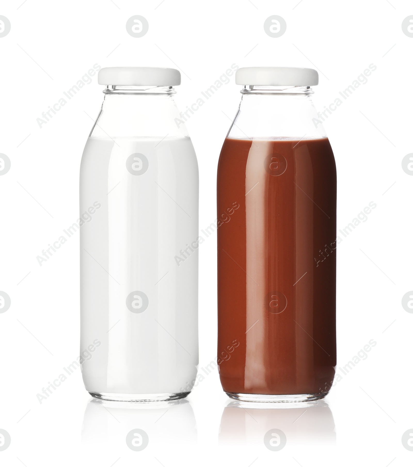 Chocolate drink and milk in glass bottles isolated on white Image of Chocolate drink and milk in glass bottles isolated on white
