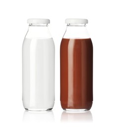 Image of Chocolate drink and milk in glass bottles isolated on white