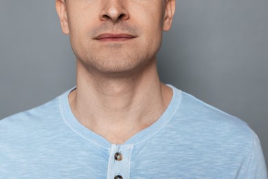 Photo of Man after shaving on grey background, closeup