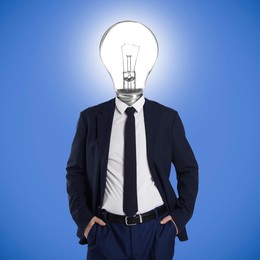 Image of Man with glowing light bulb instead of head on blue background