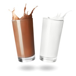 Image of Chocolate drink and milk splashing out of glasses on white background