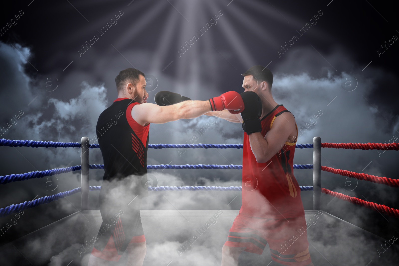 Boxers surrounded by smoke fighting in ring. Sporting event Image of Boxers surrounded by smoke fighting in ring. Sporting event