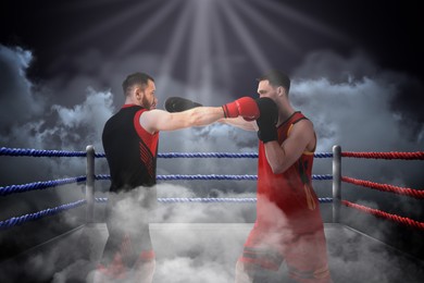 Image of Boxers surrounded by smoke fighting in ring. Sporting event