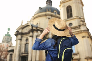 Image of Tourist with backpack on city street, low angle view. Space for text