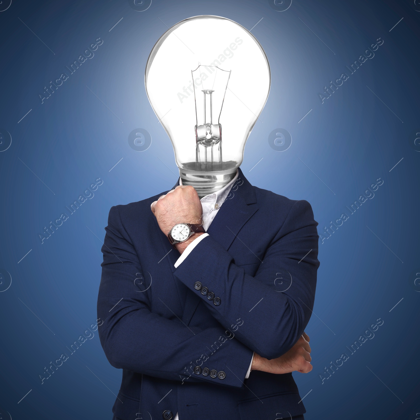 Man with glowing light bulb instead of head on blue background Image of Man with glowing light bulb instead of head on blue background