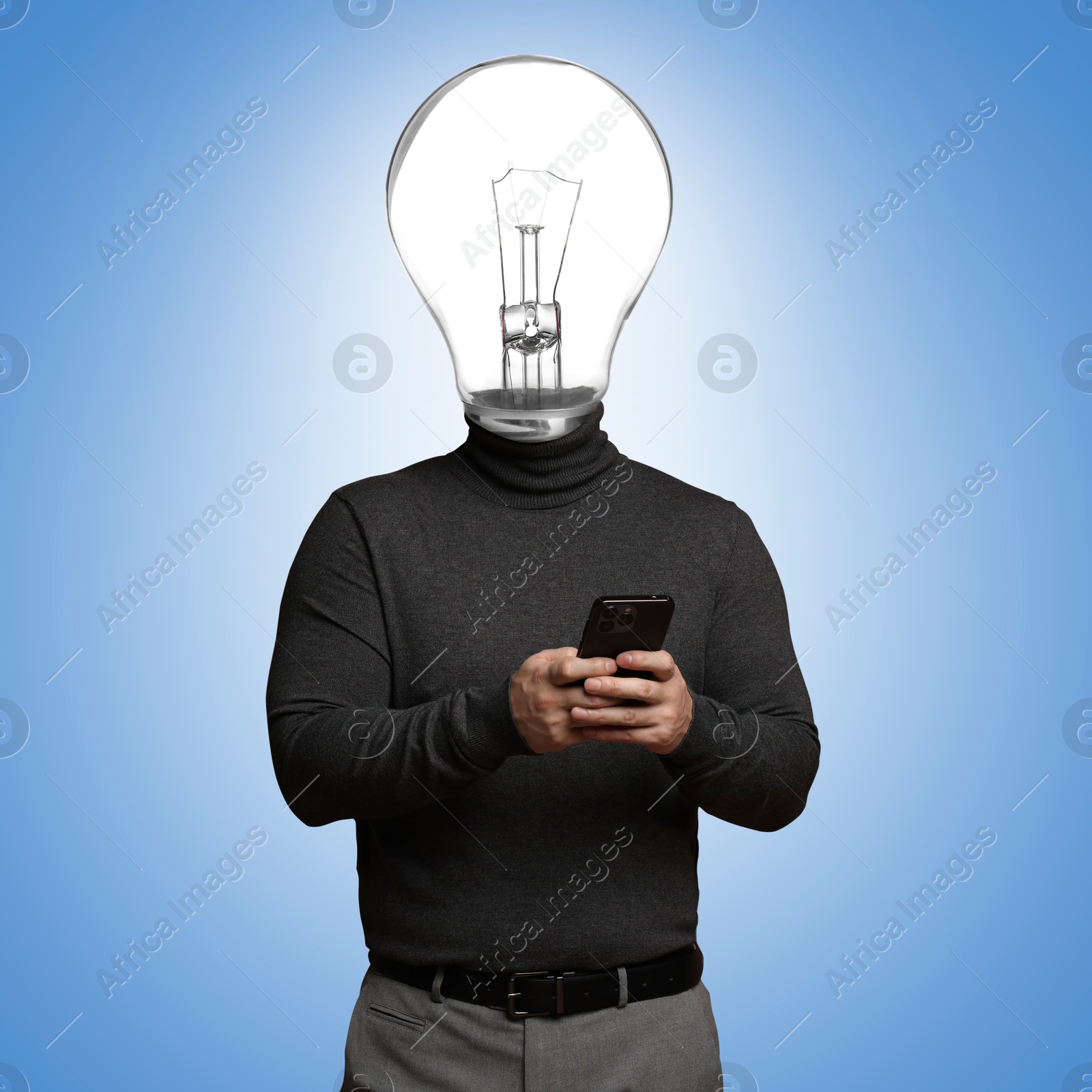 Man with glowing light bulb instead of head and smartphone on light blue background Image of Man with glowing light bulb instead of head and smartphone on light blue background