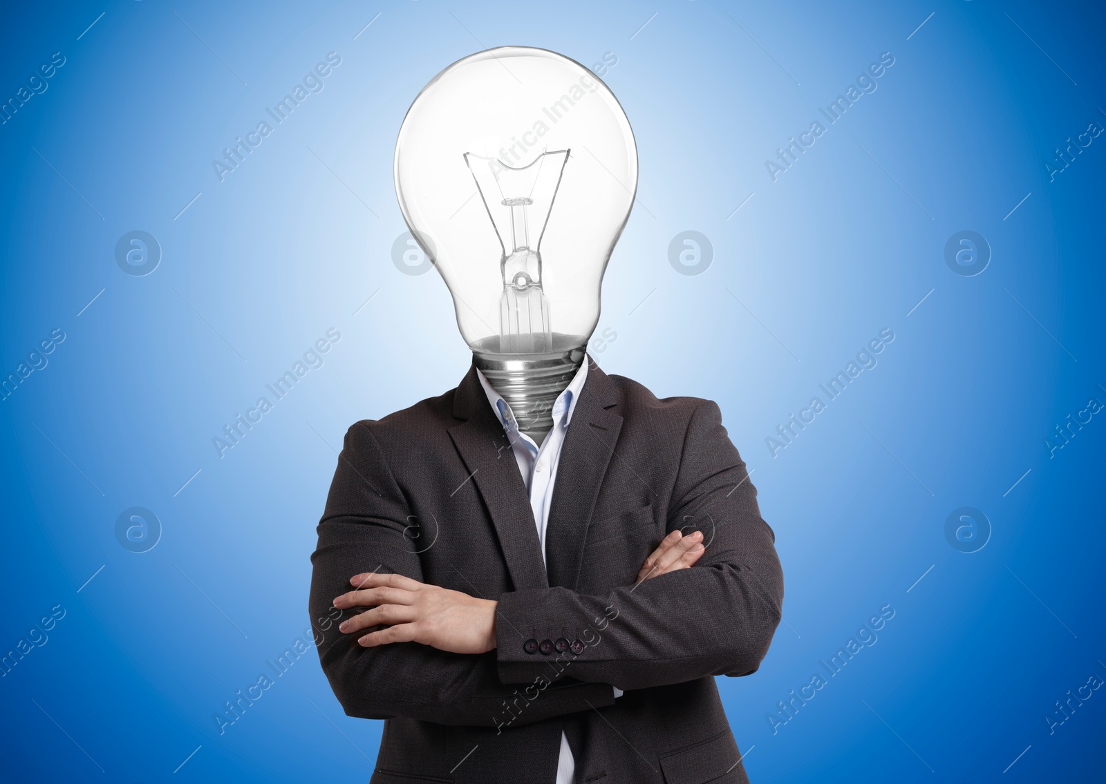 Man with glowing light bulb instead of head on blue background Image of Man with glowing light bulb instead of head on blue background