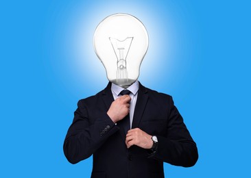 Image of Man with glowing light bulb instead of head on light blue background