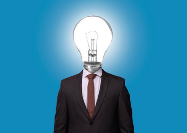 Image of Man with glowing lightbulb instead of head on light blue background
