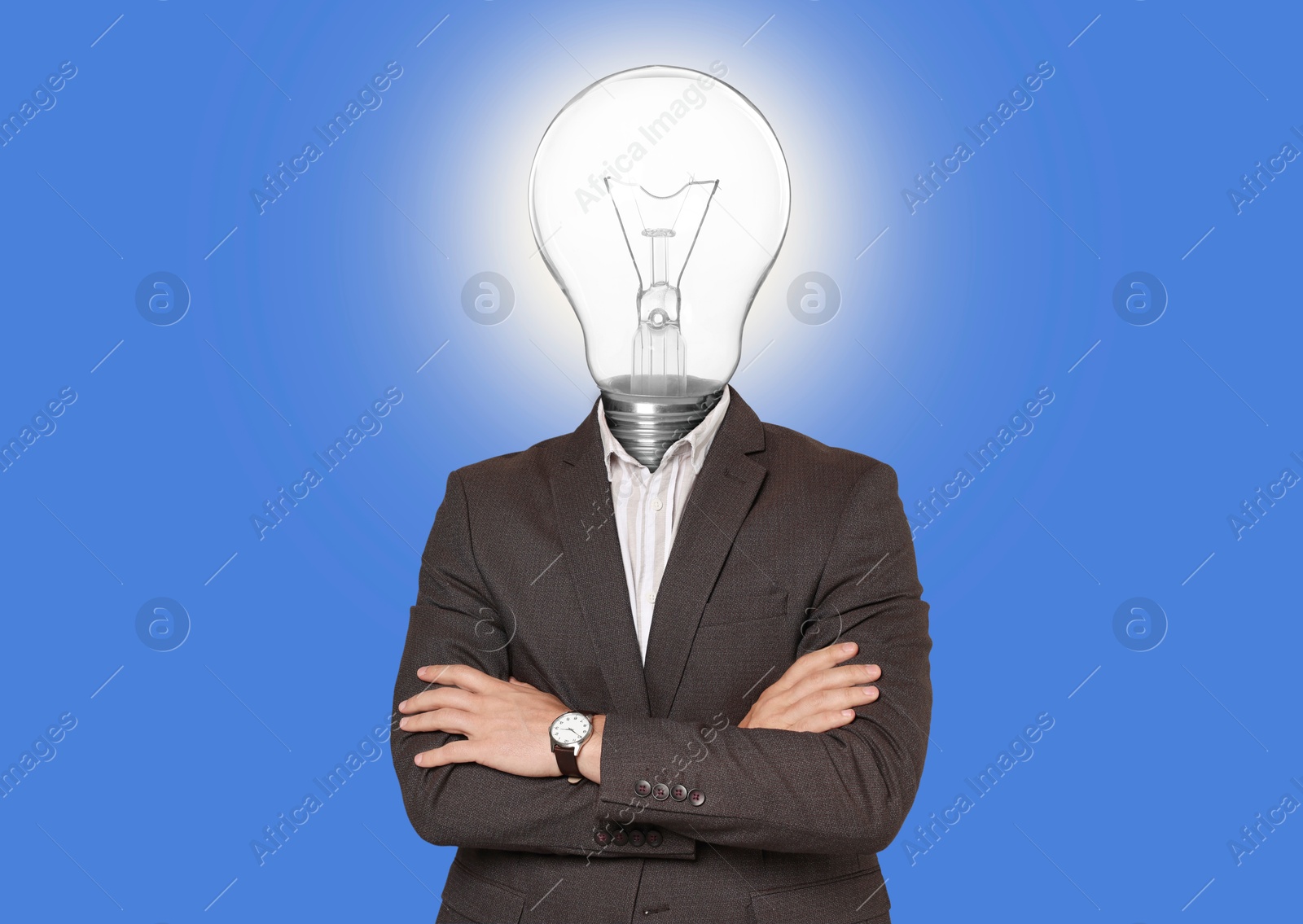 Man with glowing light bulb instead of head on blue background Image of Man with glowing light bulb instead of head on blue background