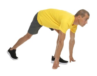 Photo of Runner in starting position on white background
