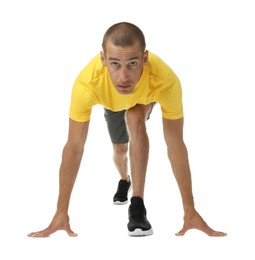 Photo of Runner in starting position on white background